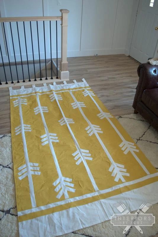 Interiors by Kenz - painted geometric arrow curtains - via Bekob