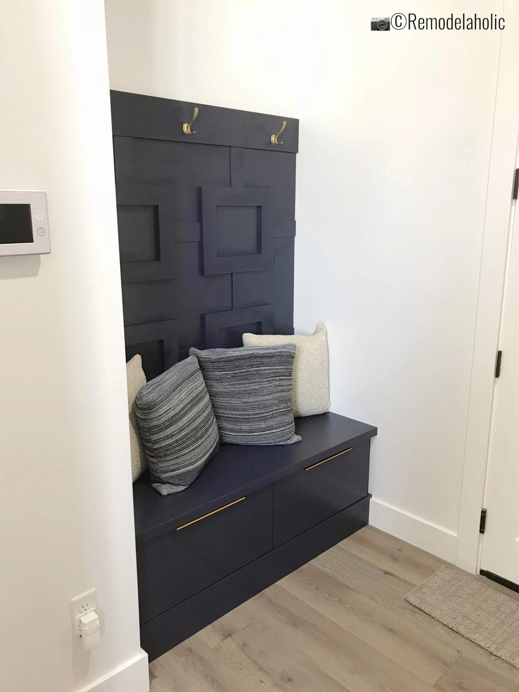 Add fretwork or board and batten and a contrasting color for a fun mudroom area. SLPH 2018 Home 20 The Building Group, Photo by Bekob