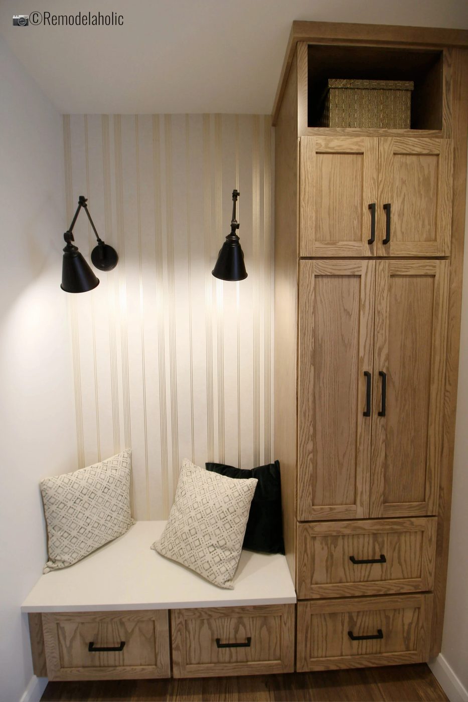 Add lighting and wallpaper to a mudroom area. SLPH Model Home 1 Holmes Homes, Photo by Bekob