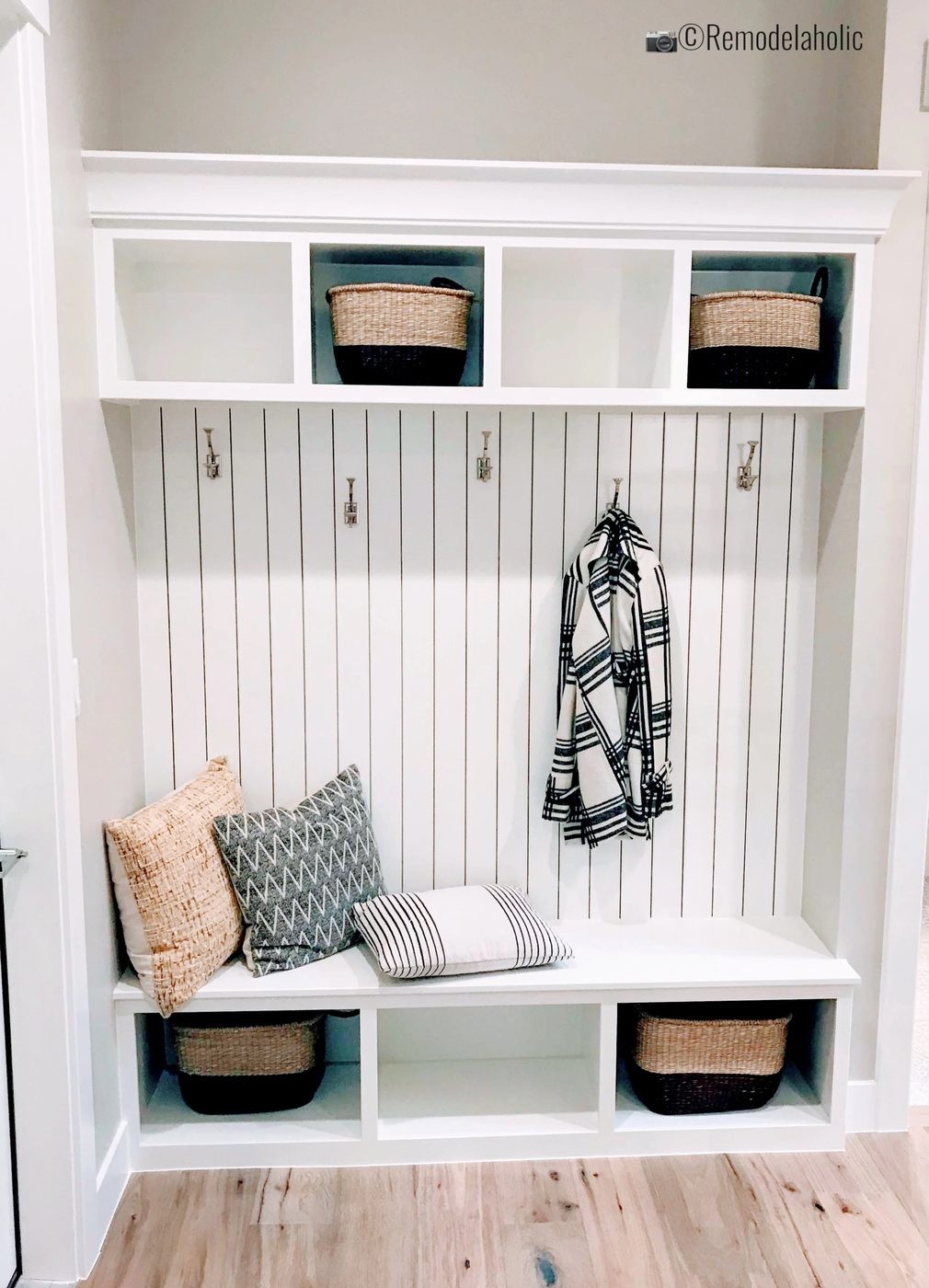Add vertical shiplap above a bench with cubbies, SPGH 2019 House 27 Slate Ridge Homes, Inc, Photo by Bekob