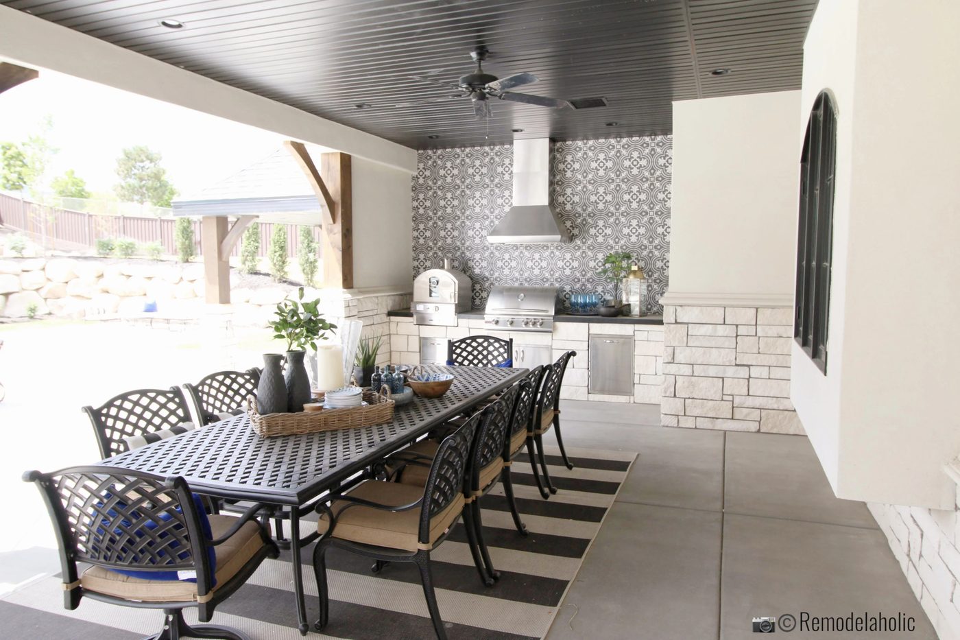 Outdoor kitchen with pretty touches. UVPH 2018 Home 30 Shelby Homes, Gatehouse No. 1 Furniture & Design, Photo by Bekob