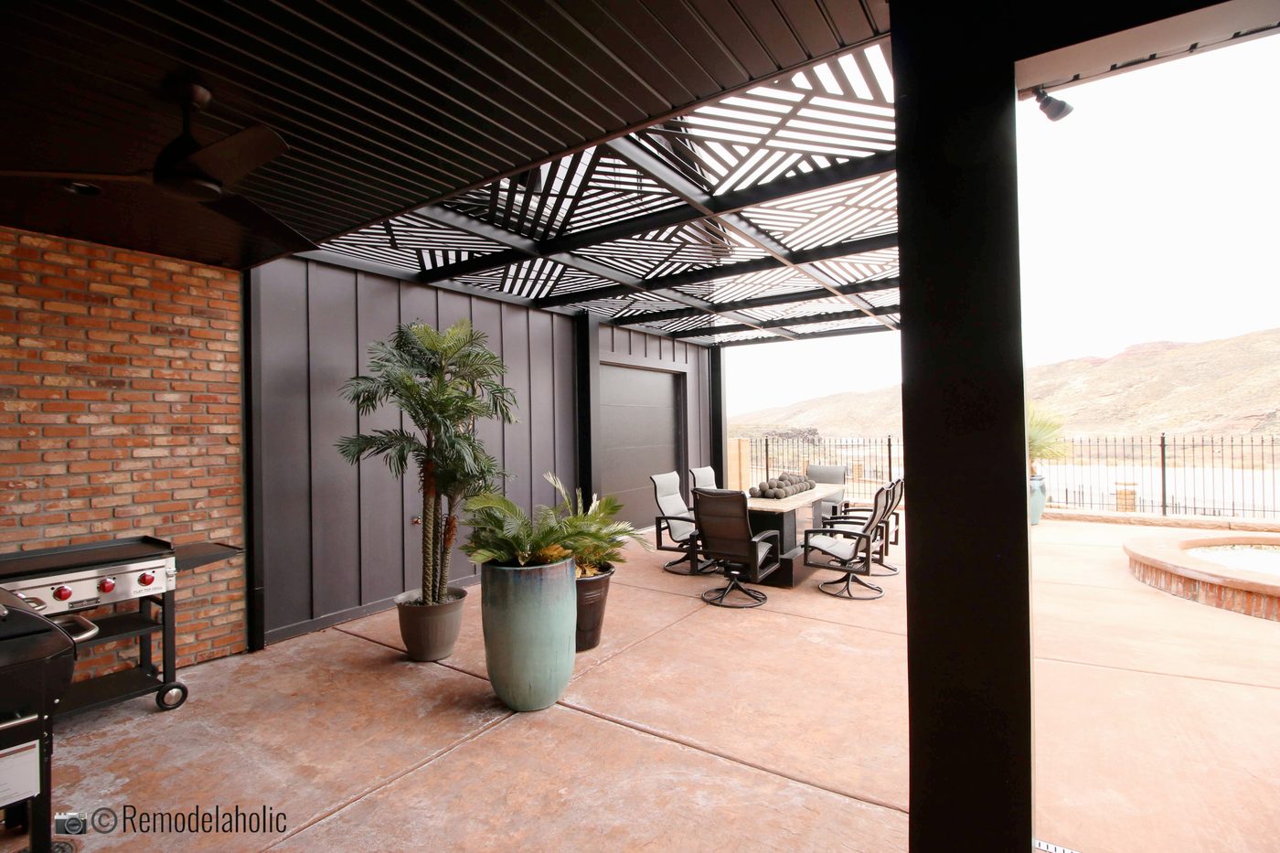 Pergola over an outdoor dining area. SGPH 2019 House 04 Interstate Homes, Photo by Bekob