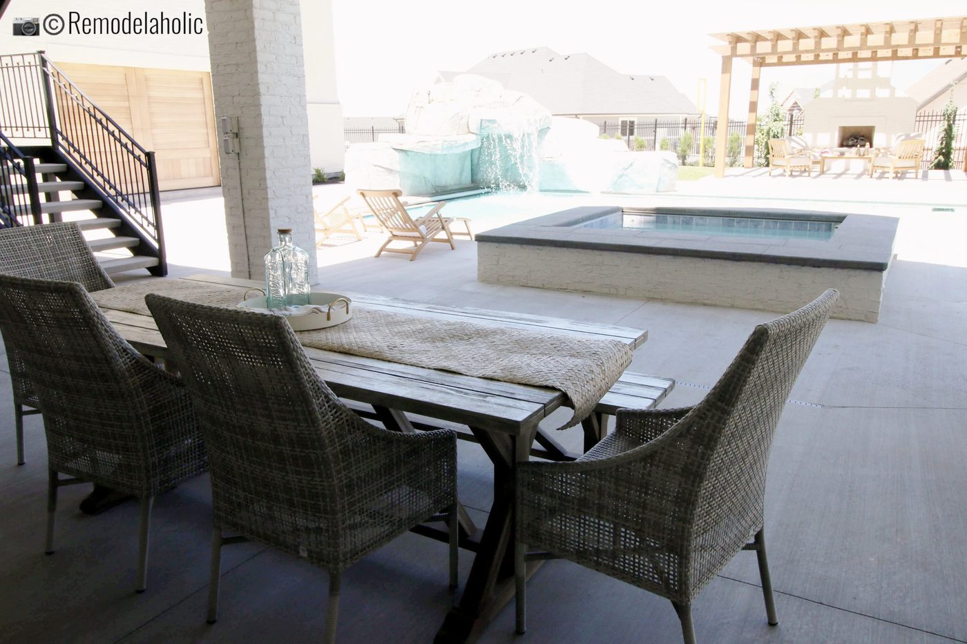 Outdoor dining area near the hot tub. UVPH 2018 Home 4 Raykon Construction, Erin Hansen Design, Photo by Bekob