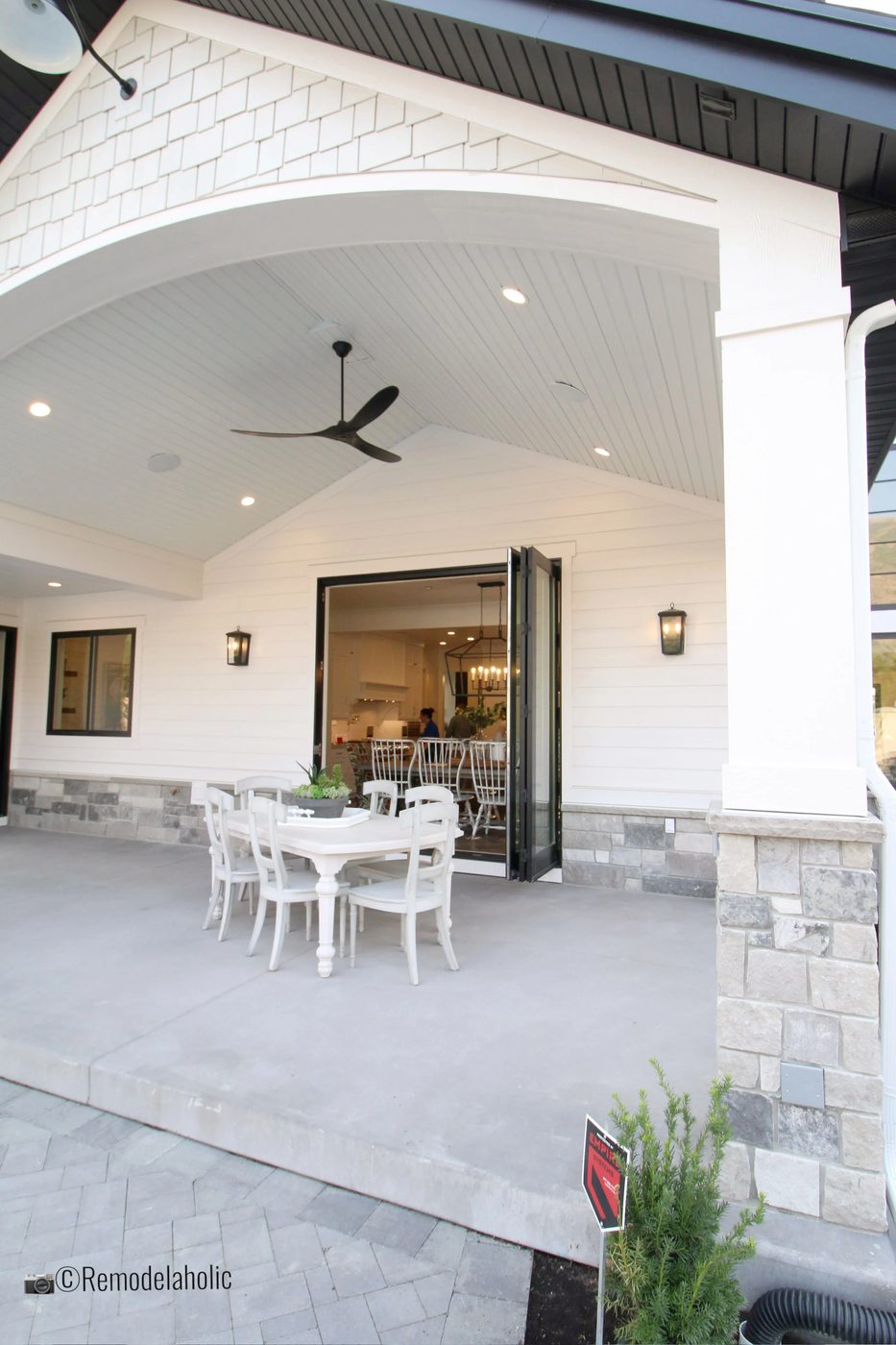 Pretty covered patio with fan and table. SLPH 2018 Home 6 Bradshaw Homes & Property, Photo by Bekob
