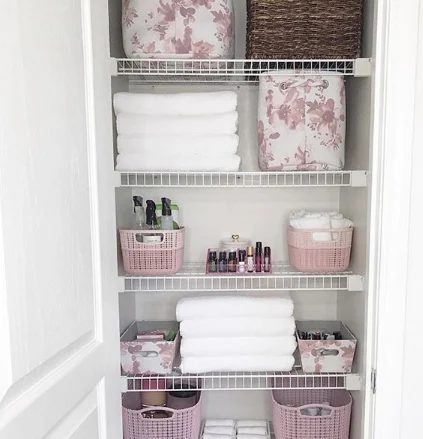Linen Closet Organization with coordinating colorful baskets