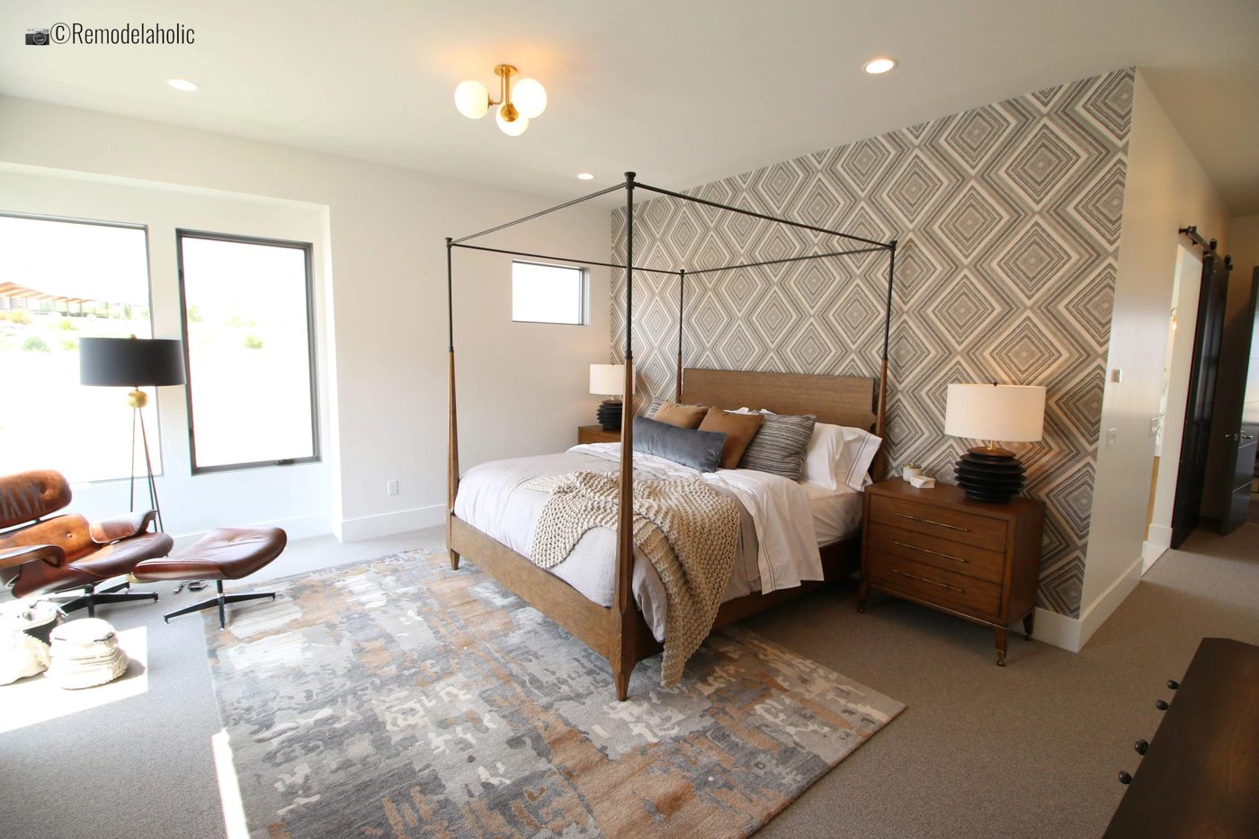 Master bedroom with geometric or aztec wallpaper feature wall, SLPH 2018 Home 14 Magleby Communities, Photo by Bekob