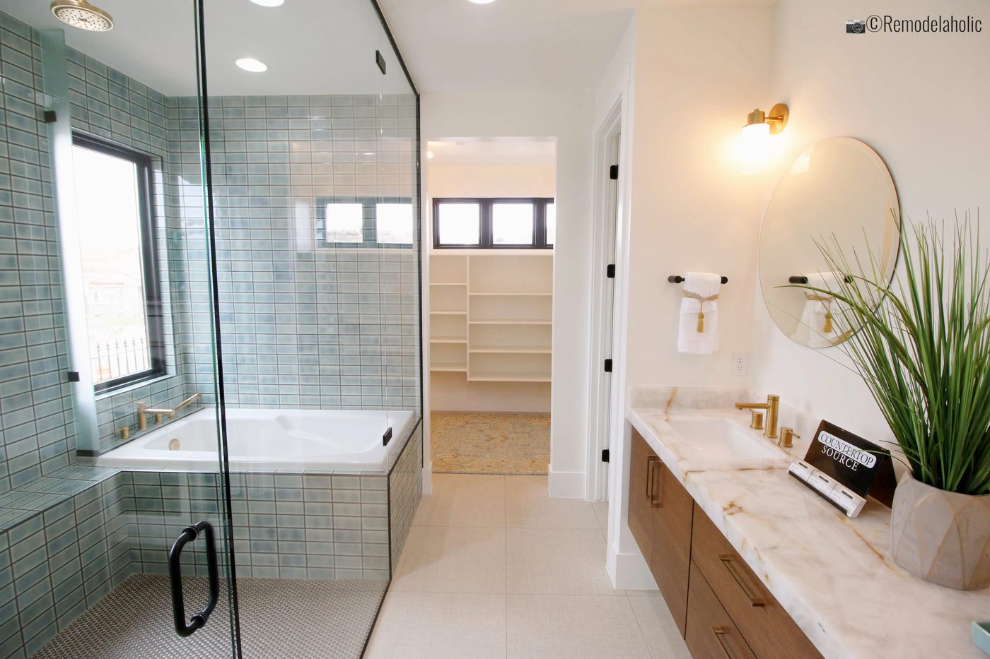 Add a fun plant to your bathroom with a modern concrete planter, SGPH 2019 House 04 Interstate Homes, photo by Bekob
