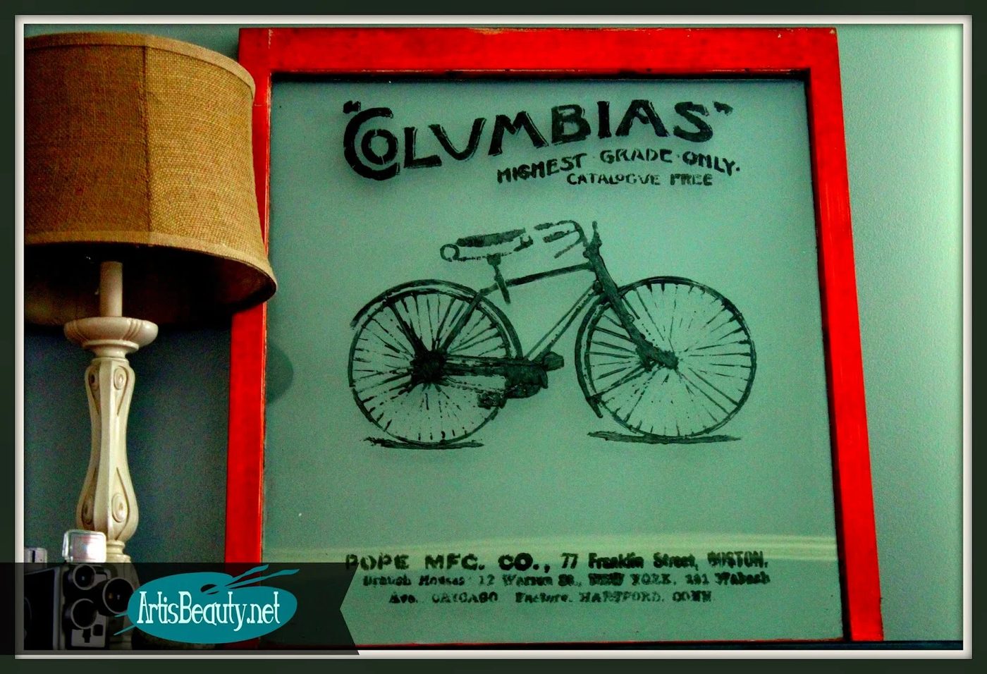 Art Is Beauty - vintage bike advertisement painted on an old window
