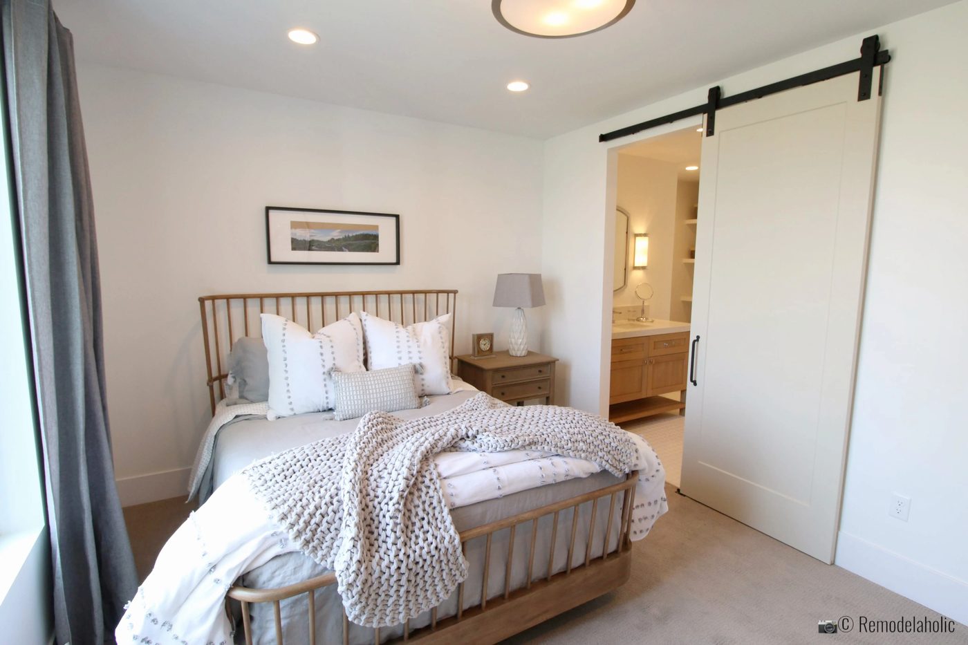 Wood spindle headboard and footboard in the master bedroom, SLPH 2018 Home 13 Magleby Communties, Photo by Bekob