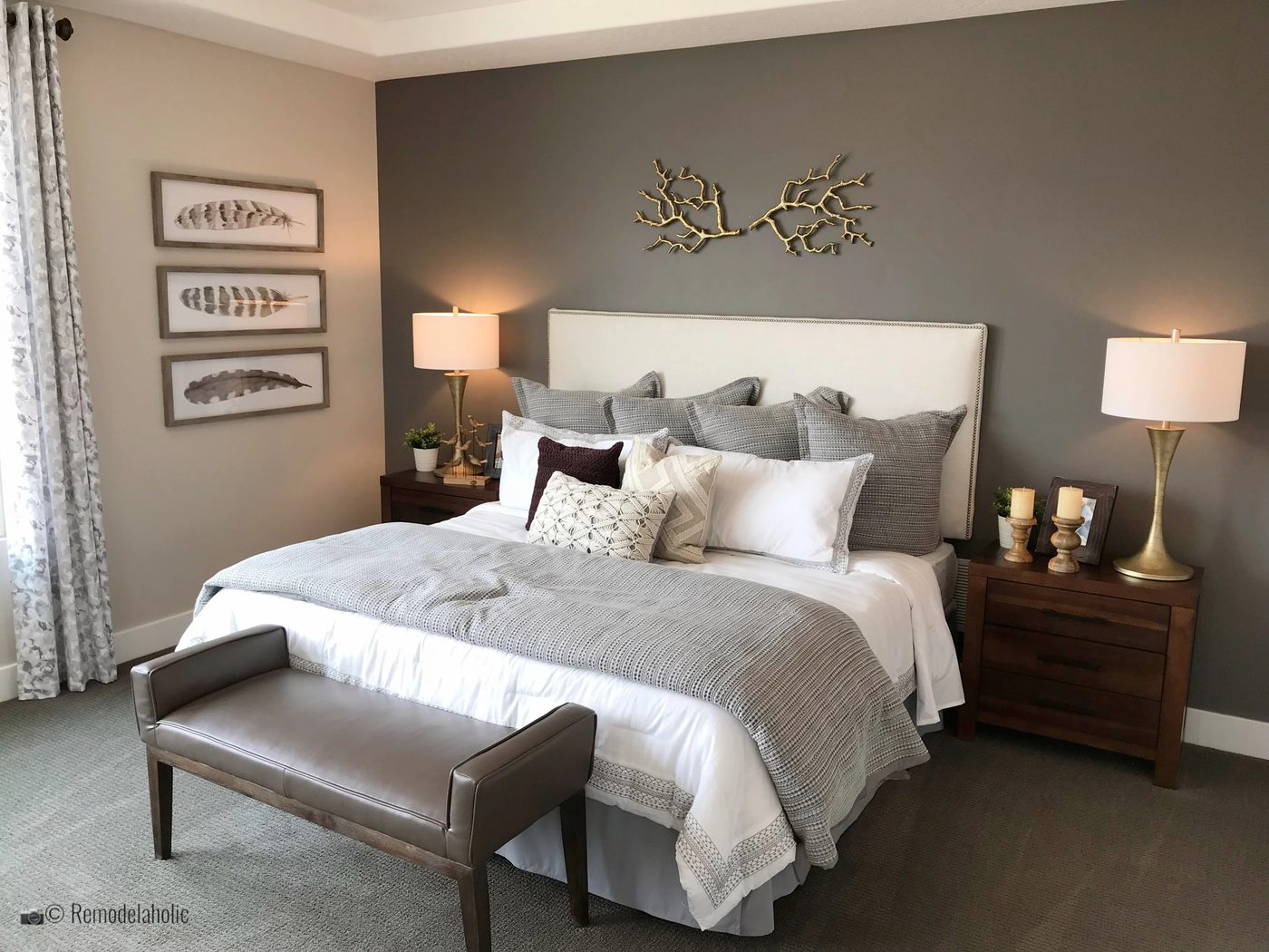 Elegant master bedroom with an upholstered headboard, SLPH 2018 Home 18 Oakwood Homes, Photo by Bekob