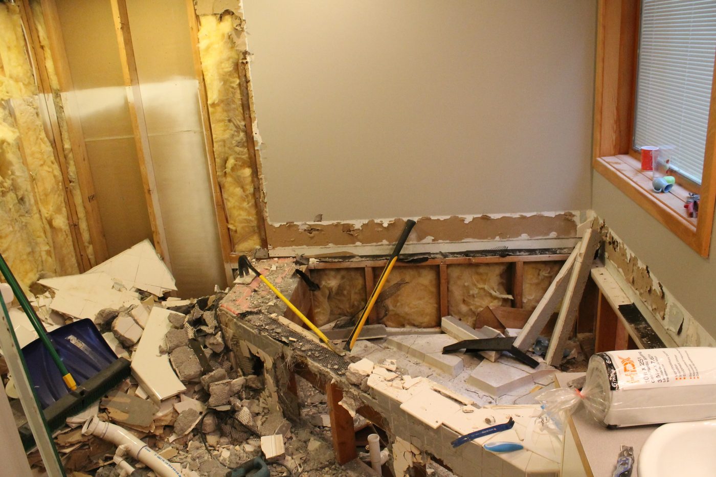 bathroom demo before remodel and wood plank walls