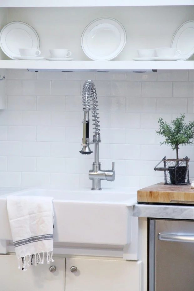 Kitchen makeover with subway tile backsplash and marble countertops -- without removing the old countertops OR the backsplash