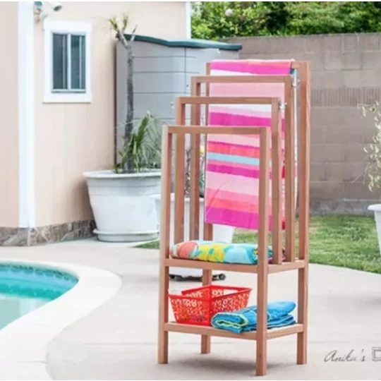 Handmade Wooden Pool Stand Holding Colorful Towels And A Basket Of Toys