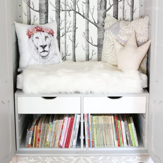 Reading Nook With Trees And Faux White Fur And Lion Pillow, Crown Pillow, Drawers And Books