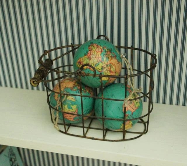globe details of antique suitcase bookshelf, featured on Bekob.com