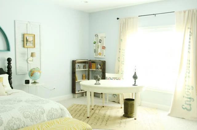 full shot of antique trunk bookshelf in the cottage guest room, featured on Bekob.com