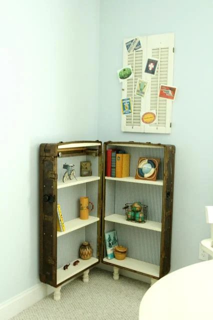 finished bookshelf from an antique trunk and travel postcard shutter display, featured on Bekob.com