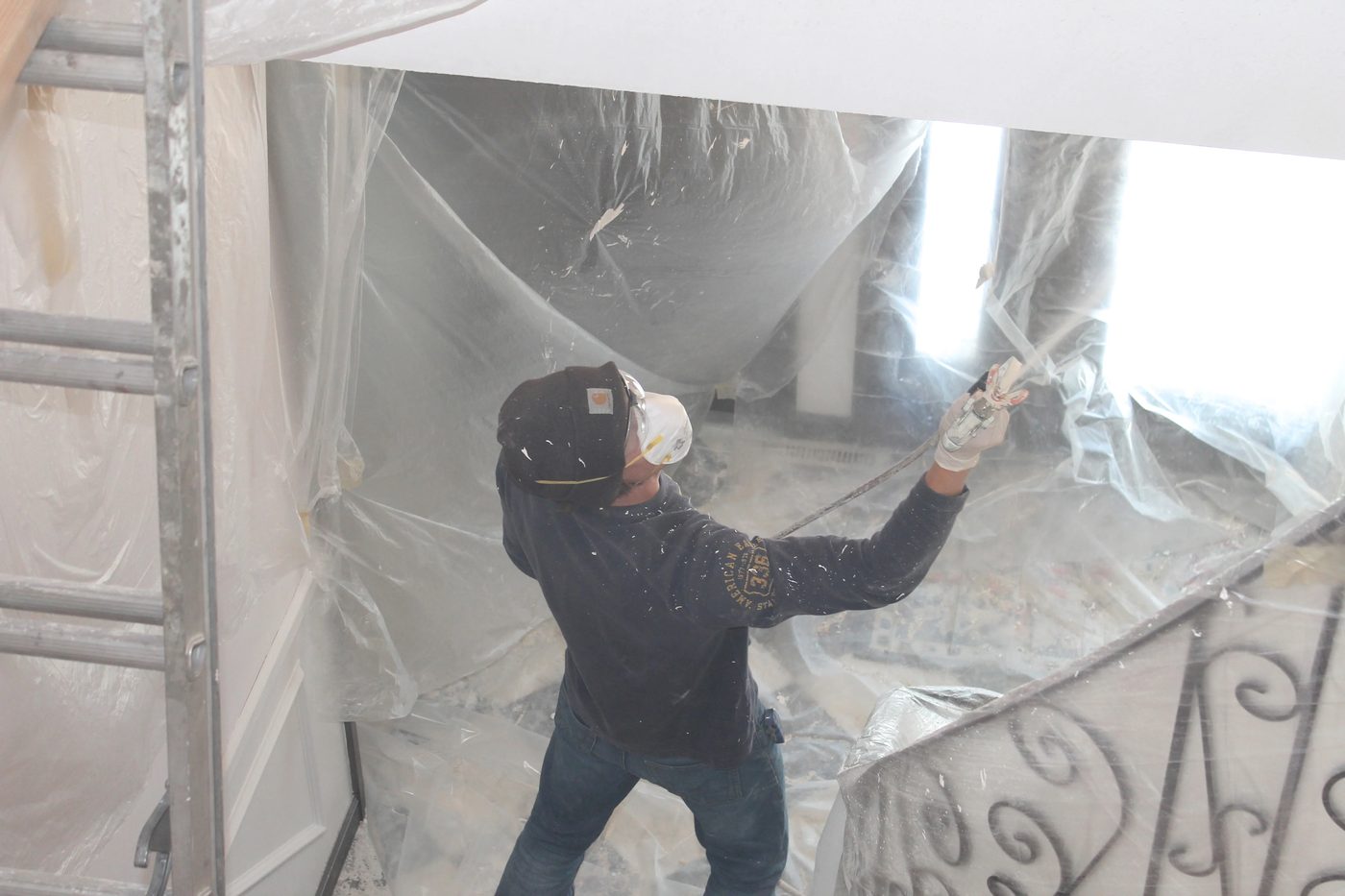 applying knockdown ceiling texture using a spray gun