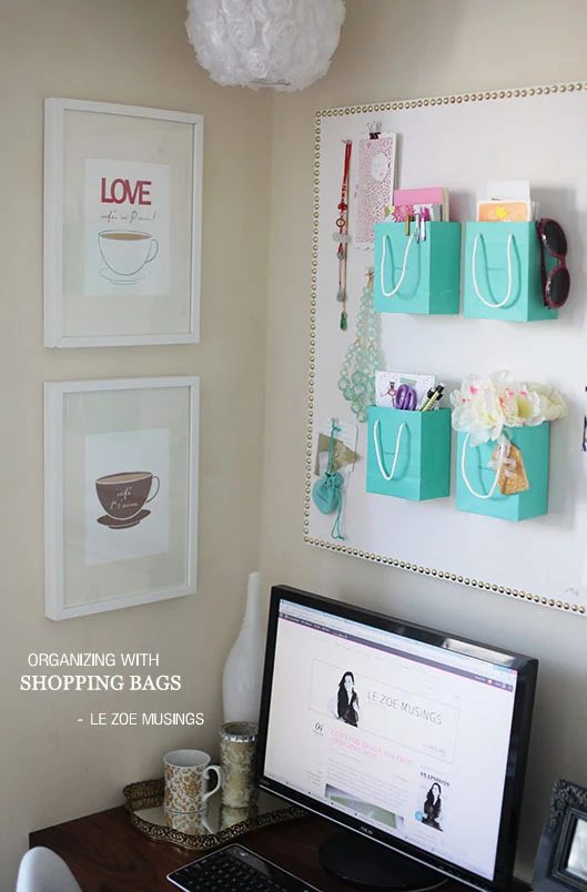 Handmade wall organizer using shopping bags and corkboard