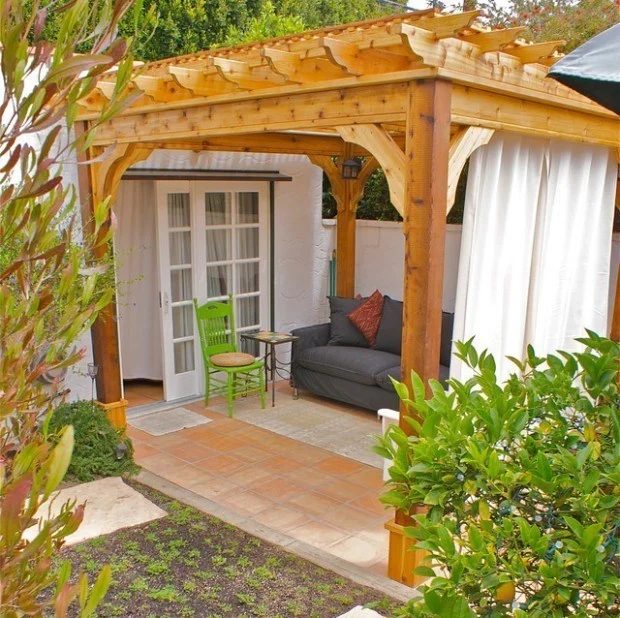 Handmade Pergola Stained Wood With Couch On Patio Underneath
