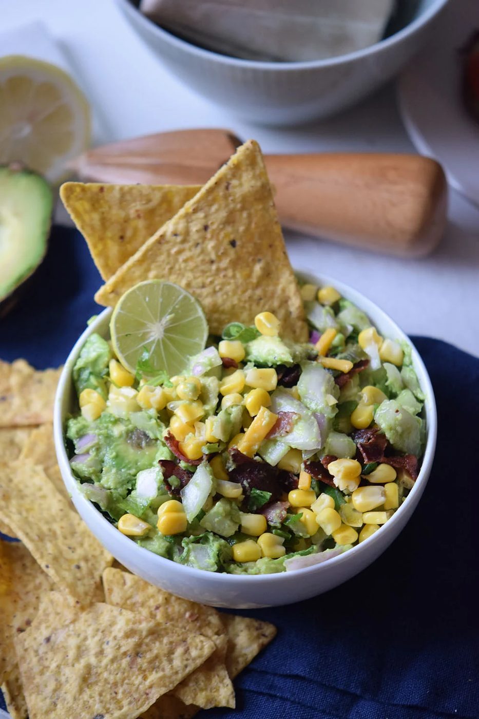 Need a yummy appetizer to bring to a party? Try this delicious bacon corn guacamole recipe via Bekob.com