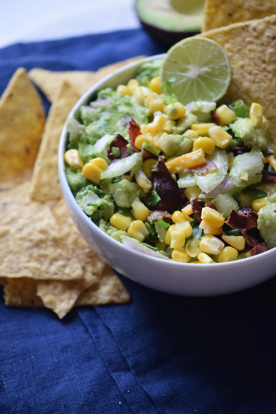 Need a yummy appetizer to bring to a party? Try this delicious bacon corn guacamole recipe via Bekob.com