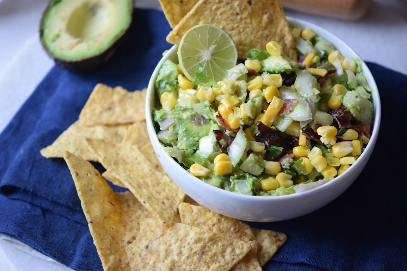 Cut the bacon into small pieces and cook them in a saucepan over medium heat until crispy. Remove from the saucepan and set them aside. Take the corn to a pan over medium heat, add
