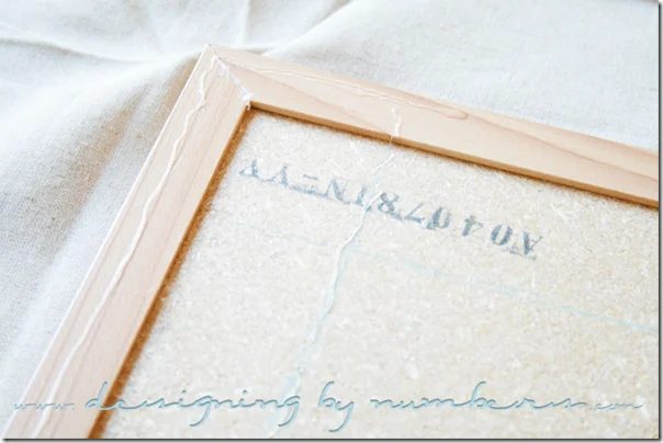 Apply glue on the back of the corkboard and on the back of the frame
