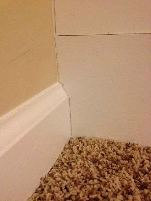 use caulk and filler to fill the gaps for barn door style wainscoting