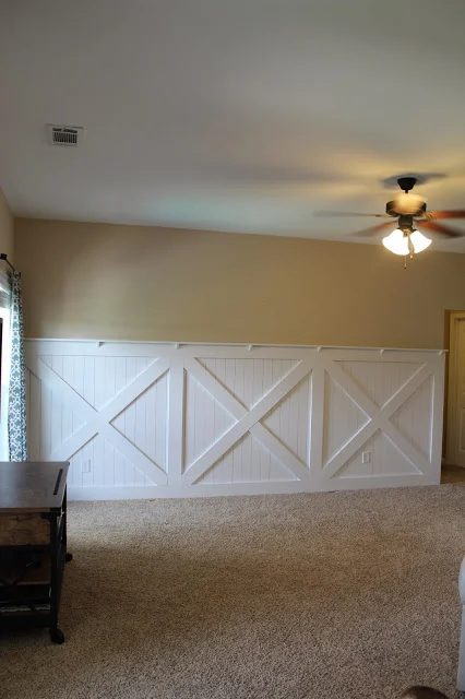 finished barn door wainscoting wall treatment