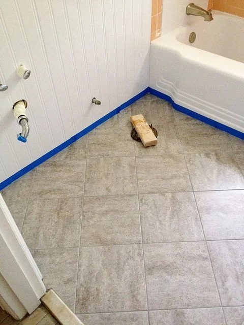 Updating an old bathroom with graoutable peel and stick tiles (5)