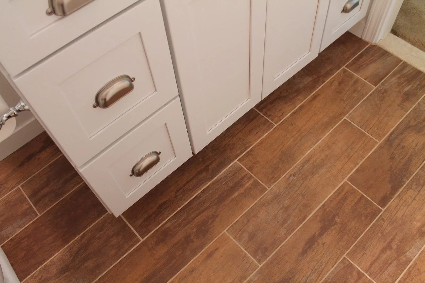 21 Woodgrain tile used in bathroom remodel, by Elizabeth and Co featured on @Bekob
