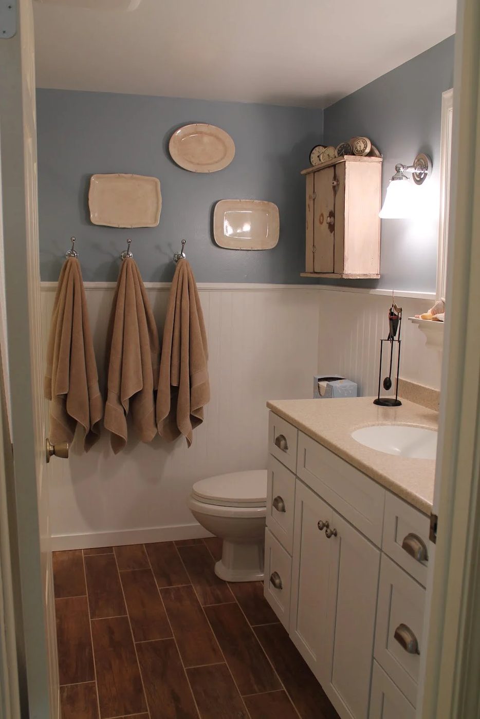 1 Bathroom Remodel using woodgrain tile, by Elizabeth and Co featured on @Bekob