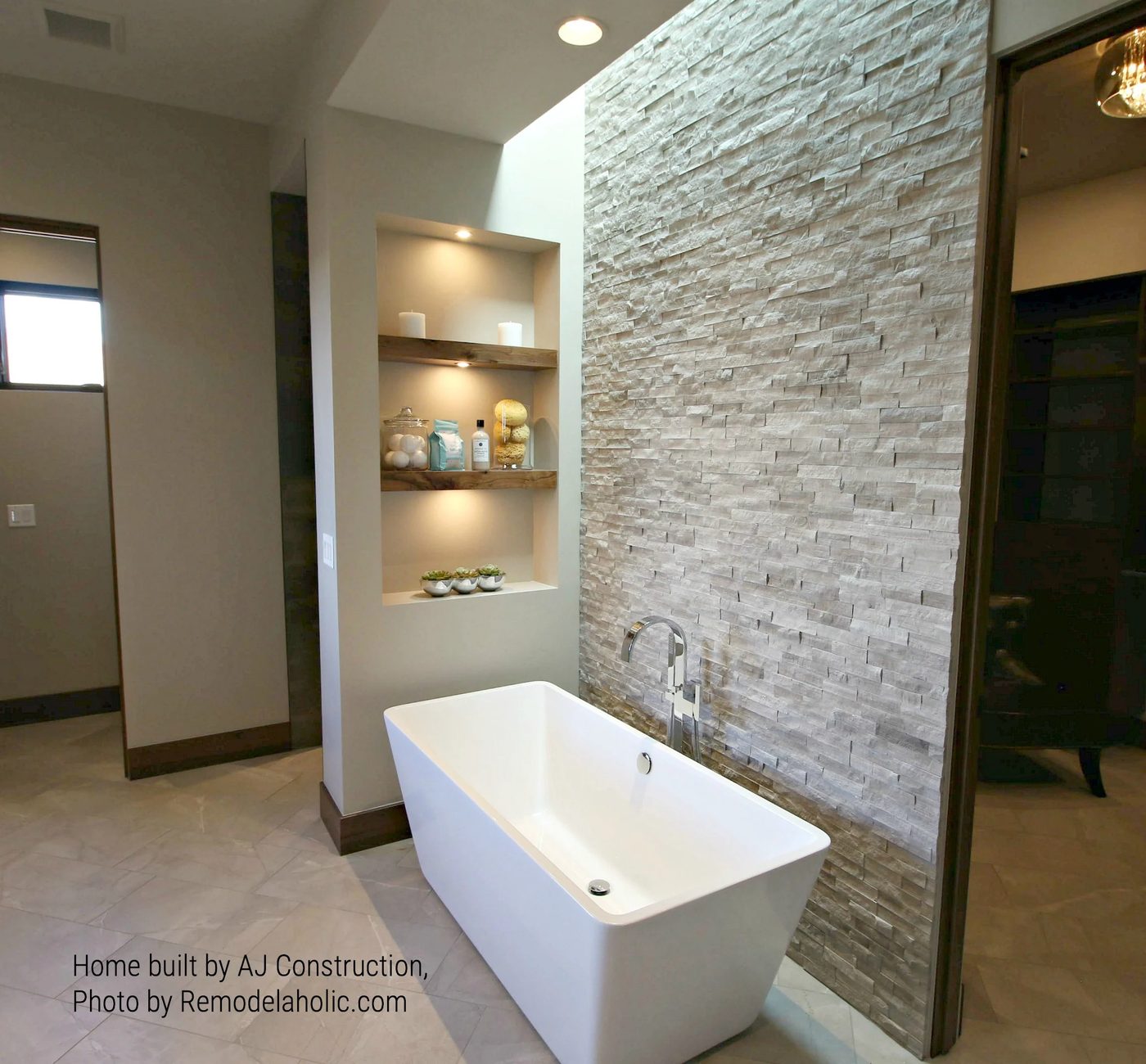 Bathtub With Stone Wall, Floating Shelves, And Skylight AJ Construction (97).ed