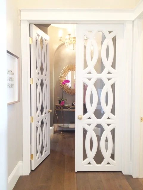 striking Doors - white French doors with circular trellis design via Klury
