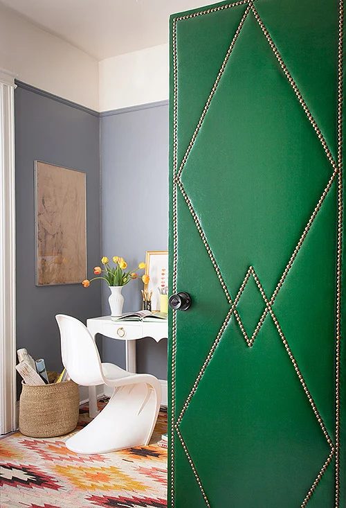 striking Doors - handmade green upholstered leather door with nailhead trim via Design Sponge