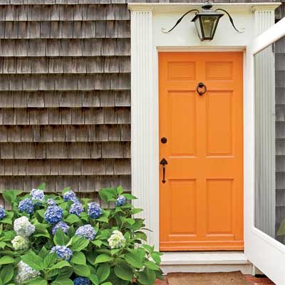 striking Doors - entry door in orange Sherwin-Williams Navel