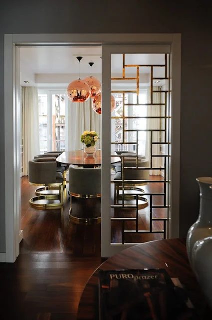 striking Doors - gold fretwork pocket door via South Shore Decorating