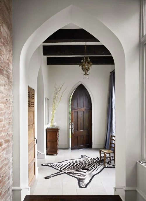 striking Doors - gothic peaked wood entry door via DecorPad