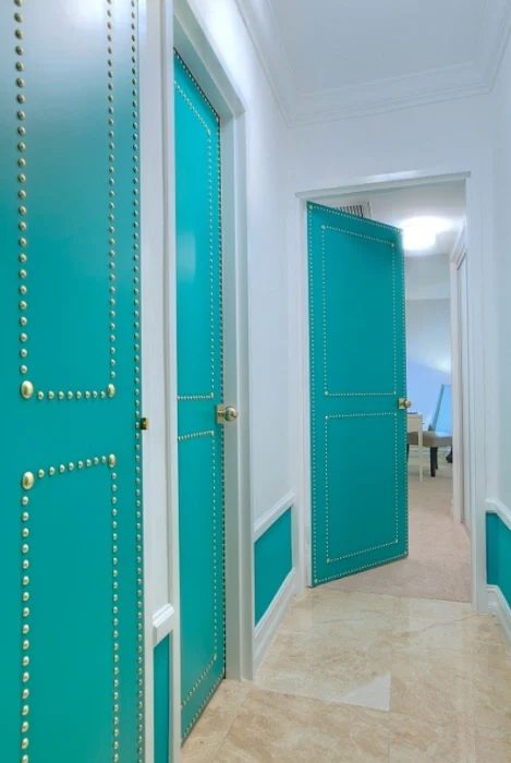 striking Doors - turquoise nailhead metal trim doors via Addicted 2 Decorating