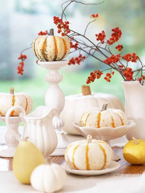 white dinnerware paired with small pumpkins and gourds Midwest Living