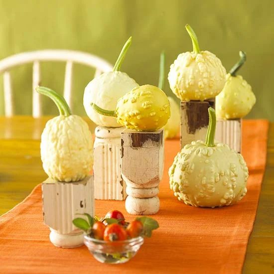 pumpkin centerpiece using pedestals made from old table legs BHG