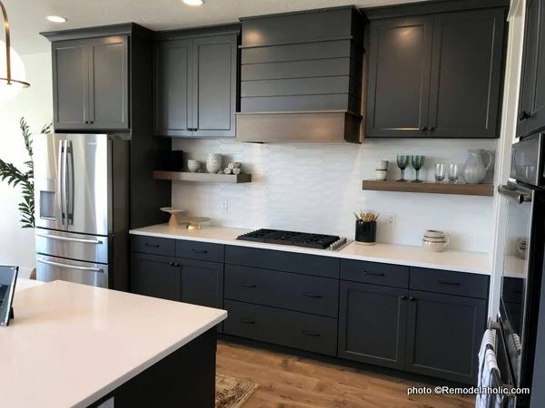 Modern dark gray kitchen cabinets with white backsplash open shelving beneath cabinets, UVPH 2018 Home 22 Mitchell Dean Homes,