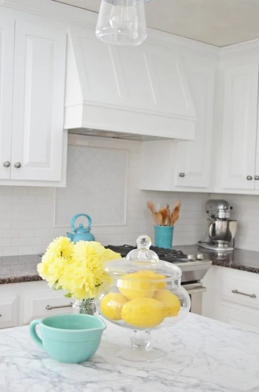 White And Grey Kitchen With Yellow, Blue And Silver Accents