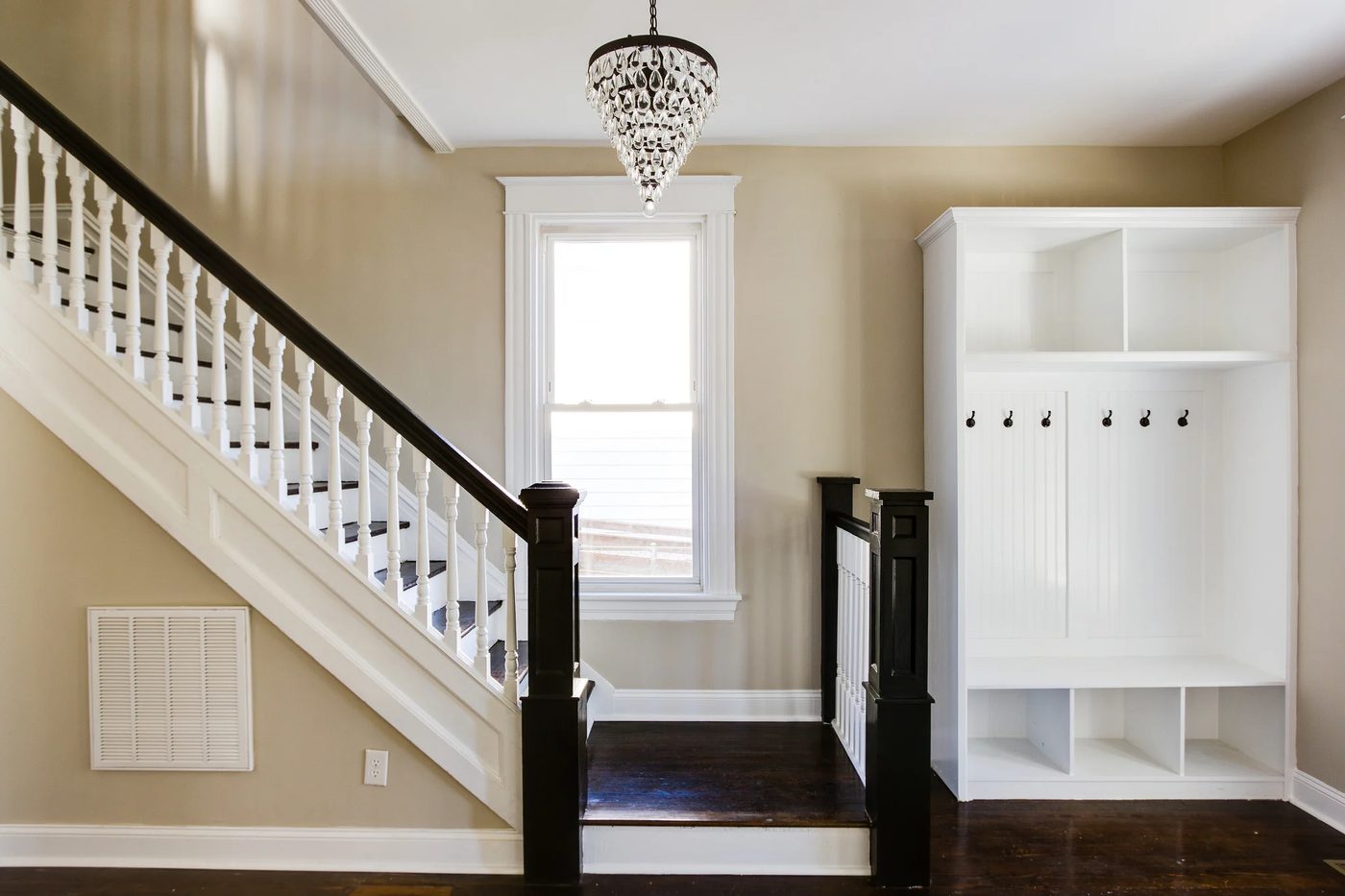 Inviting Entryway (Griffin) @Bekob built-in coat locker cubbies, walnut floor and stairs