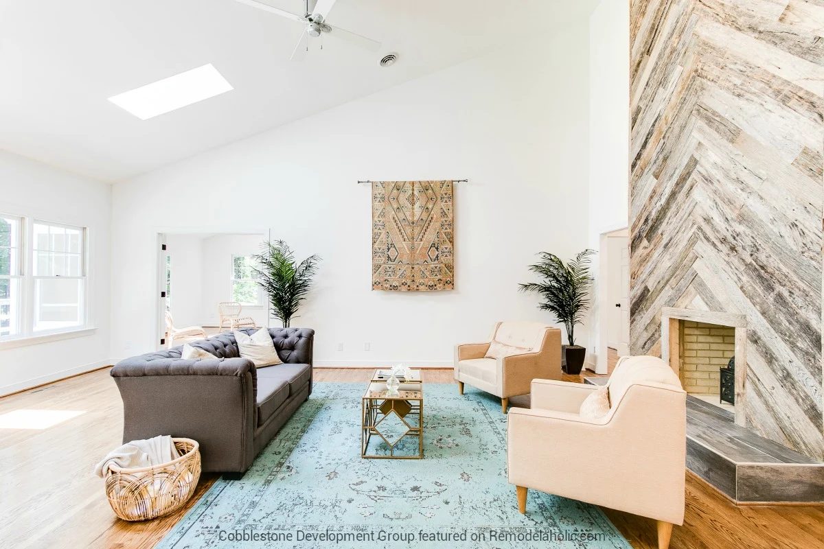 striking 1980's Open Living Room Renovation with Herringbone Wood Fireplace, Fendall Home Renovation, Cobblestone Development Group featured on @Bekob
