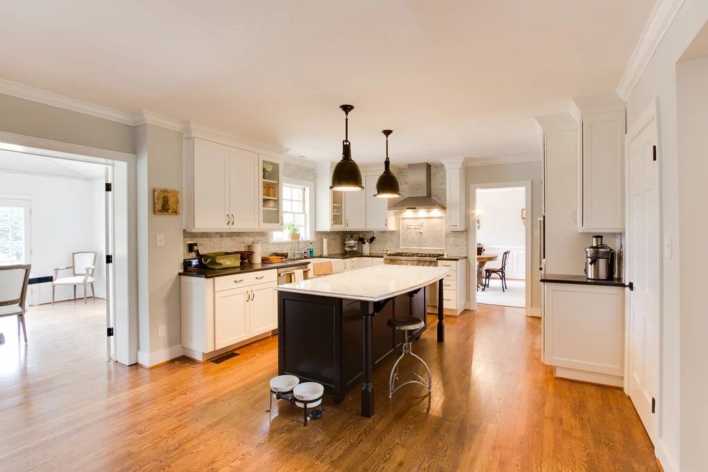 marble and white kitchen renovation with bar on Bekob
