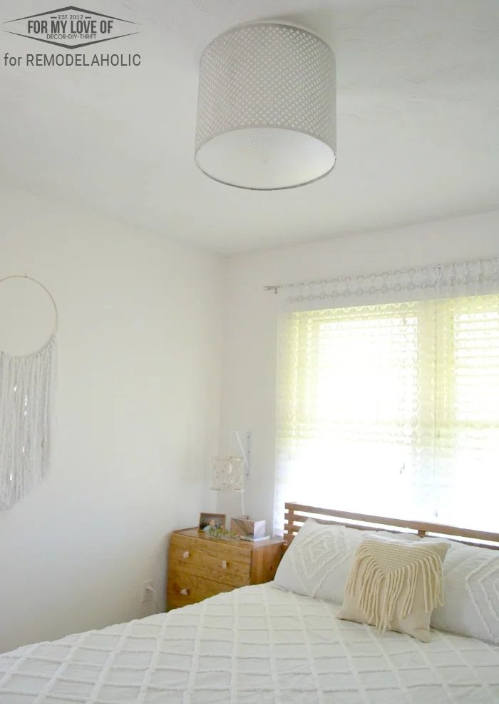 serene and relaxing bohemian bedroom existing light fixture modified to accomidate a moroccan punched metal handmade light fixture walkthrough on Bekob!