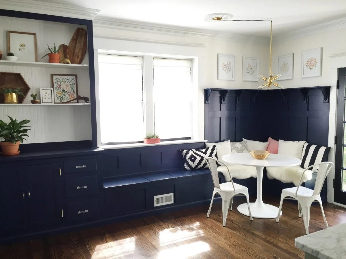 Best Blue Paint Colors Roundup - Sherwin-Williams Naval on a corner banquette bench and built-in cabinets