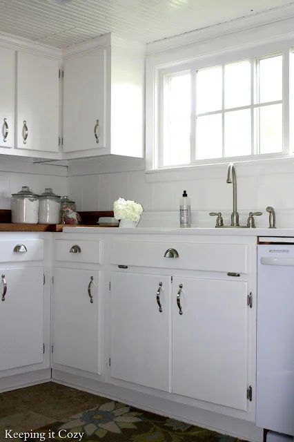 white kitchen cabinets with stainless steel pulls. best kitchen remodel options -- white painted cabinets with reclaimed wood countertops, Keeping It Cozy on Bekob